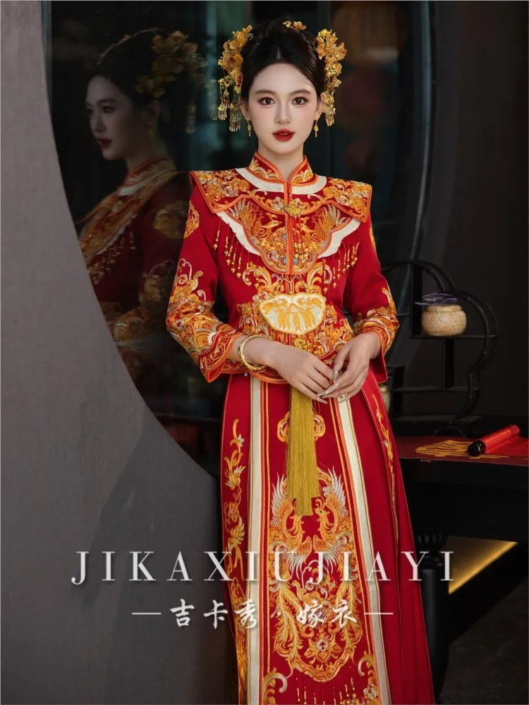 The new style of dragon and phoenix gown features a figure a dress draped in traditional Chinese ceremonial attire