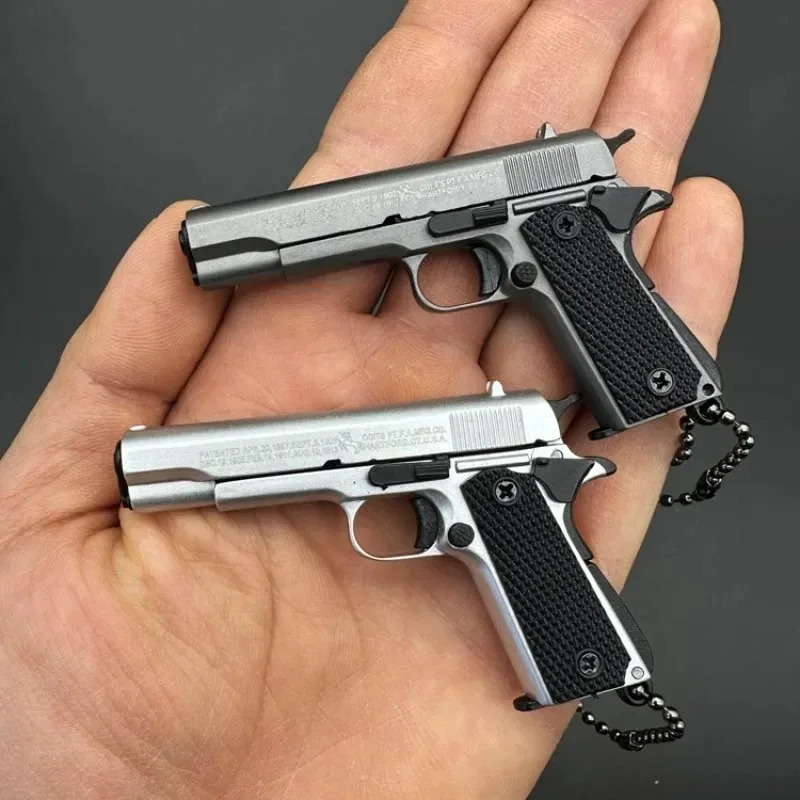 1:3 โลหะทอง M1911 Colt ของเล่นโลหะผสมปืนประดิษฐ์ MINI พวงกุญแจดูจริงคอลเลกชัน PROP วันเกิดแขวนของขวัญ