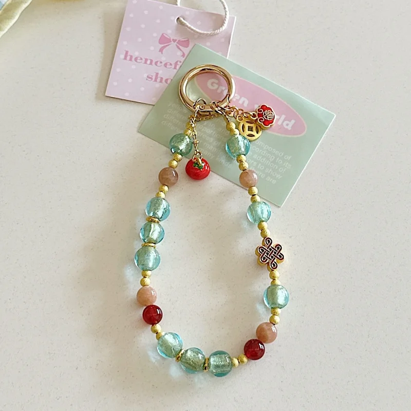 

Exquisite handmade high-end mobile phone strap, gold foil glass persimmon bracelet, fashionable phone lanyard, short bag pendant