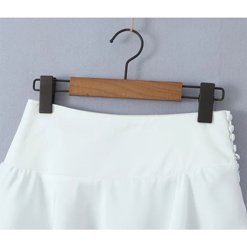 YENKYE New Women Sexy Low Waist Asymmetric Mini Skirt Side Button Zipper White Summer Skirts