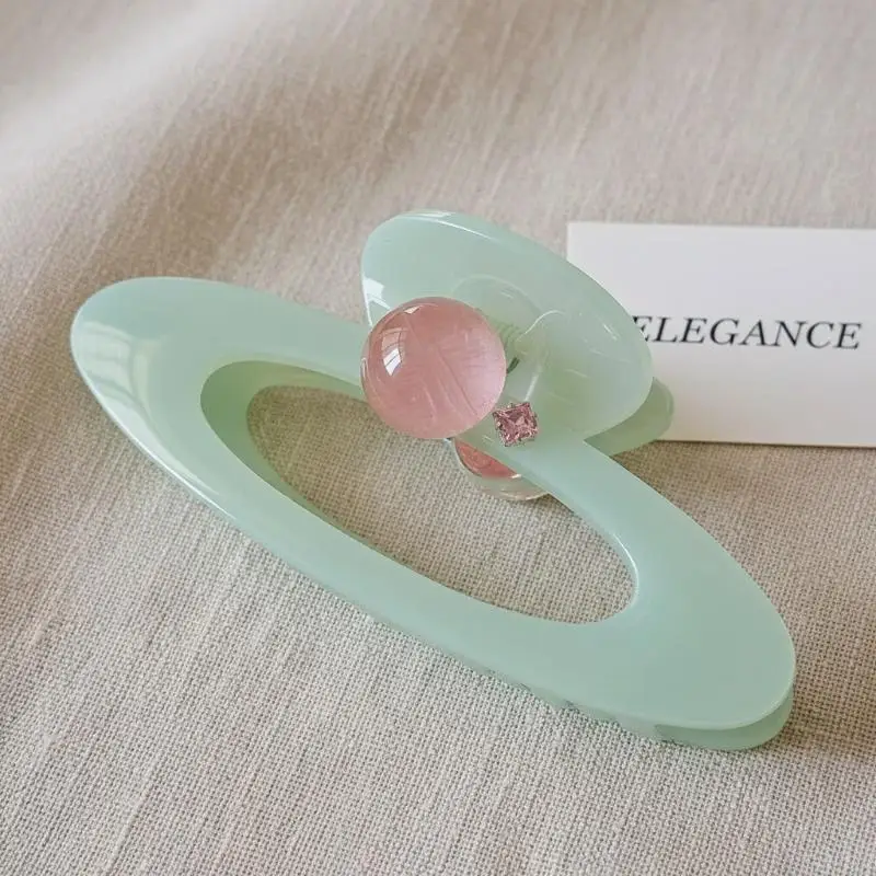 

Oval Hair Claw Clip with Pink Round Bead Elegant Hollow Out Design for Girls Casual and Party Hairstyles