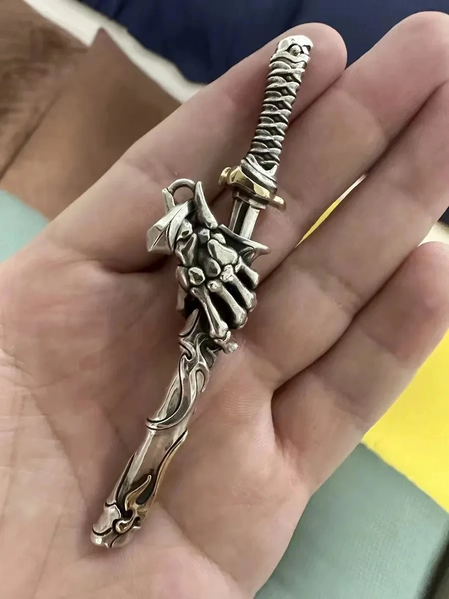 Fashion Compact and Exquisite Necklace Pendant Skull Holding Bone Sword Necklace The Sword Can Be Pulled Out From The Scabbard