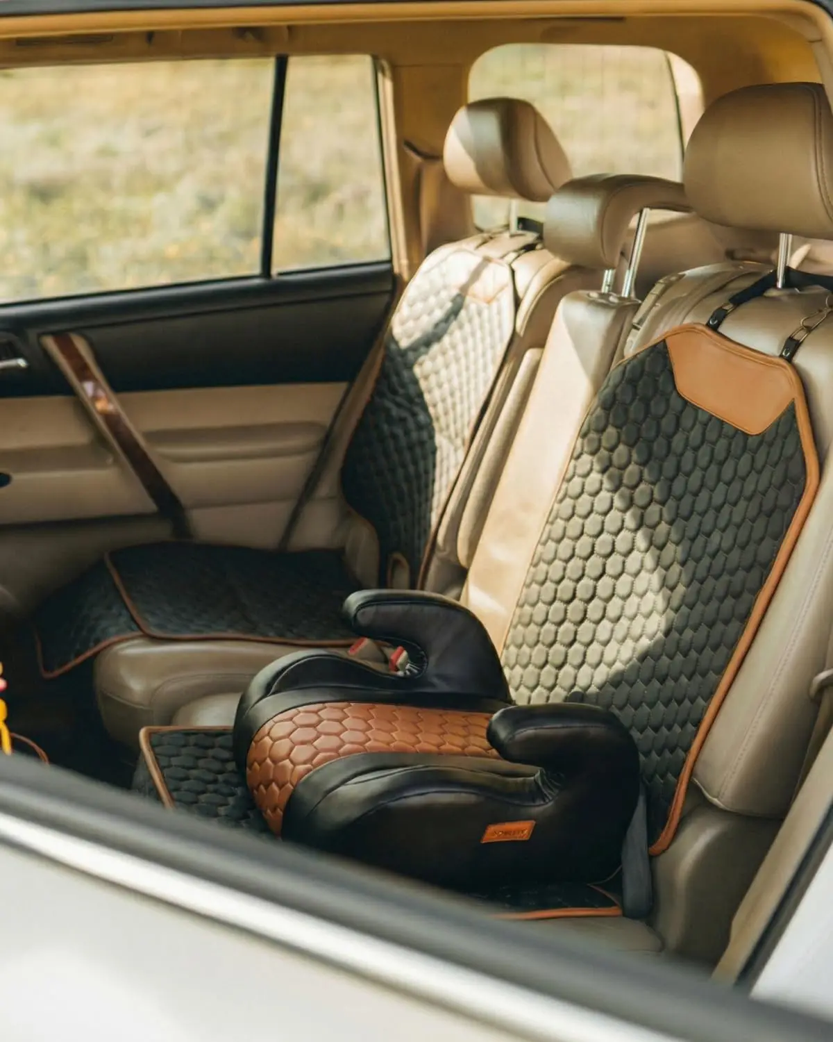 

Premium Leather Car Seat Protector for Child Safety, Waterproof and Non-Slip Design - Easy Clean Under Baby Seat