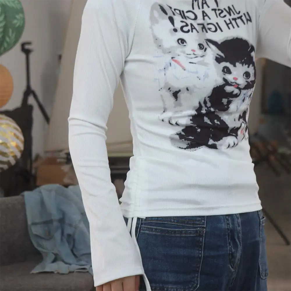 

Футболки с открытыми плечами с изображением кота, футболки с длинными рукавами и шнурком с героями мультфильмов, уличная одежда нестандартной формы, тонкие укороченные топы, весна-осень