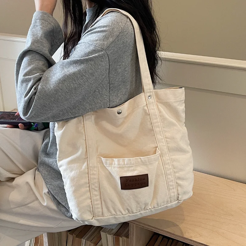 

2026 New Japanese Korean Canvas Shoulder Bag Women's Lazy Style Literary Tote Bag Large Capacity Fashion Commuter Cloth Handbags