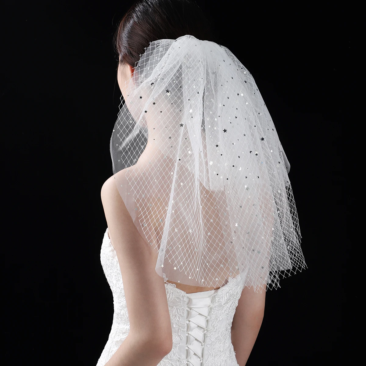 A white elegant bridal veil with a shoulder length veil adorned with sequins, suitable for women's weddings