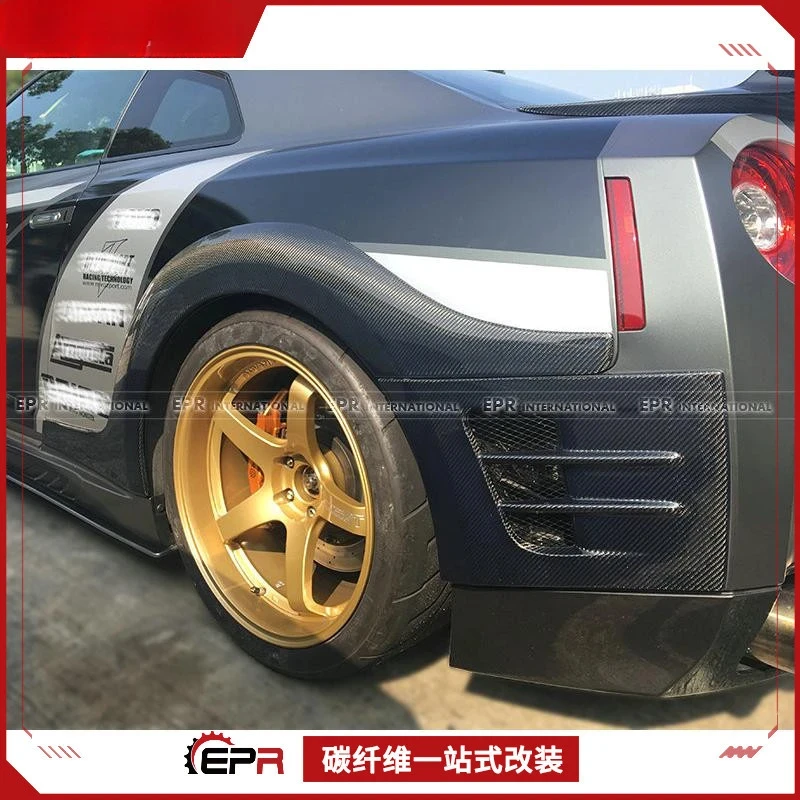 

Для модели Nissan GTR R35 TopSECRET, комплект задней широкой части кузова из углеродного волокна: колесная арка + вентиляционное отверстие бампера