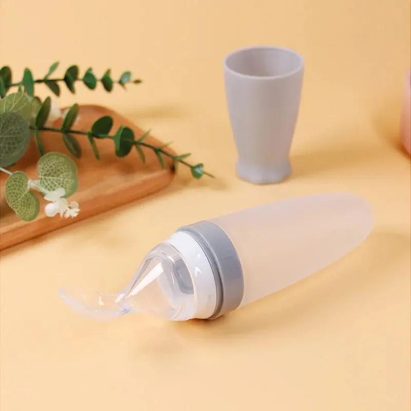 1 Pcs Baby Rice Cereal Bottle Dropper Feeding Squeeze Spoon Soft Silicone Spoon Cute Rocket Shape Soft Non Slip Feeding Bottle