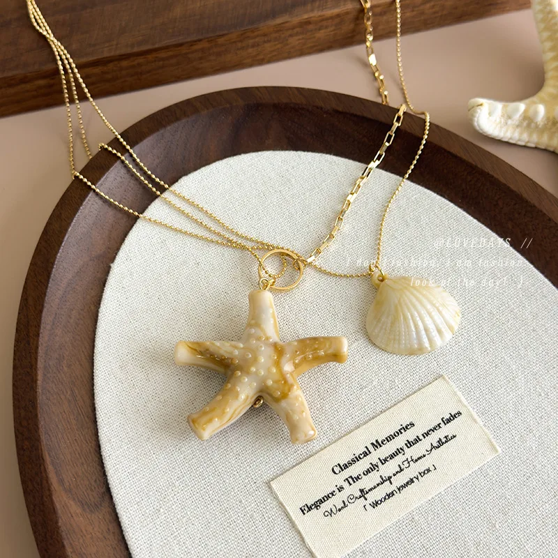 Ethereal Faux Shell Starfish Long Layered Collarbone Necklace Beach Resort Style Designer Pendant for Women Standard Length