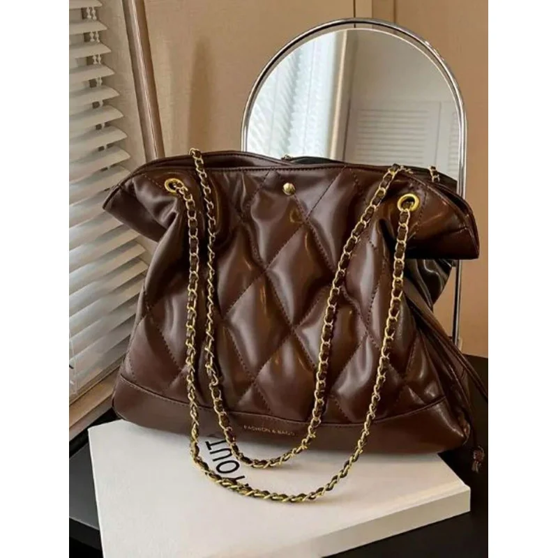 

Это стильная и высококачественная новая женская сумка с простой ромбовидным шнурком, универсальная. Это ниша через плечо