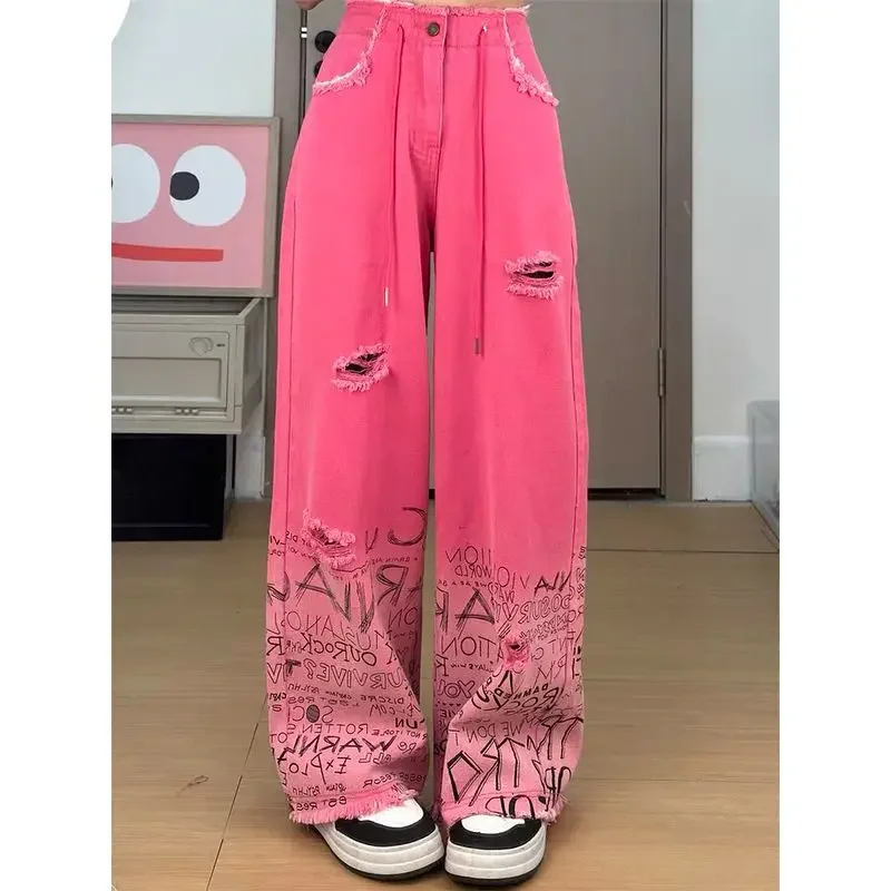 Rose red jeans female 2024 early autumn American new high-street wide-leg pants wear holes to make old graffiti minority pants.