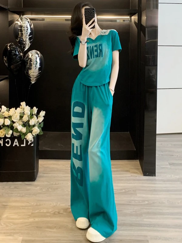 

Модный комплект уличной и спортивной одежды: женский костюм из двух предметов с коротким рукавом, кружевными вставками и широкими брюками, летняя коллекция 2026 года, модный дизайн с эффектом пэчворк