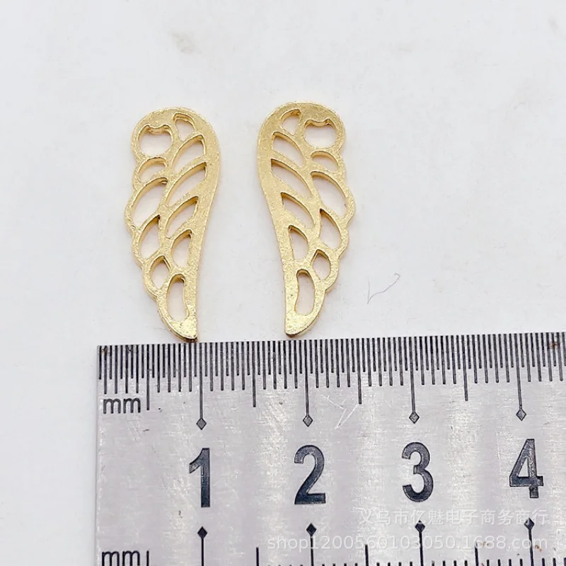 Factory Direct Sales 100Pieces diy Ornament 24x9mm Fitted Wings Hollow Wing Pendant Clothing Bags Zipper Head Materials