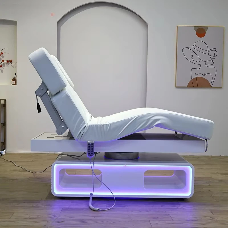 Modern and comfortable electric beauty bed with LED lighting base, ergonomic design, suitable for beauty salon furniture