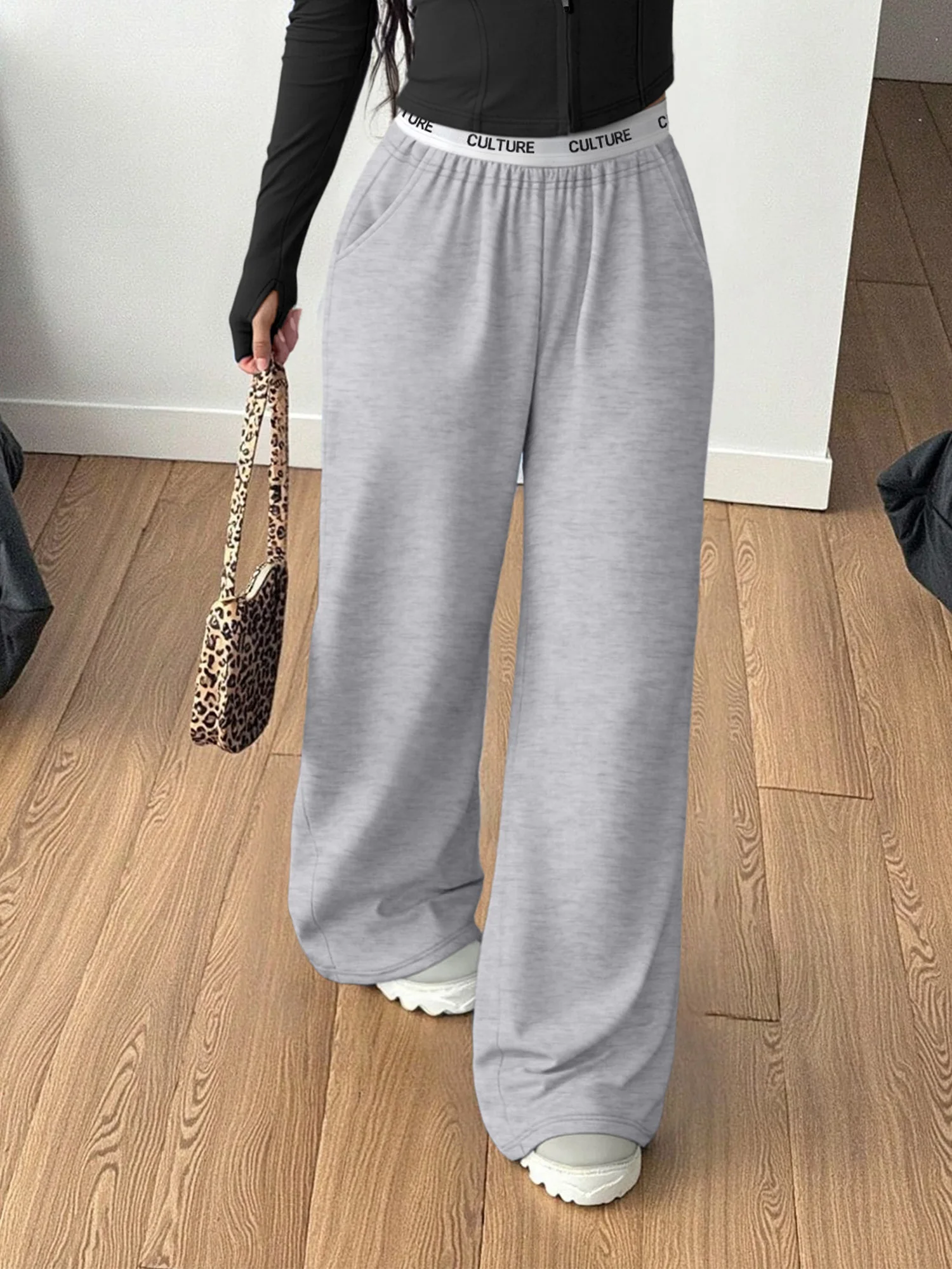 Zwarte loungebroek met wijde pijpen voor dames, ontspannen pasvorm, "CULTUUR" tailleband, zachte casual broek