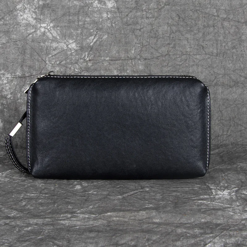 Man's handbag - a stylish and casual street trend leather handbag made of top-grade cowhide, a clutch bag with a simple design.