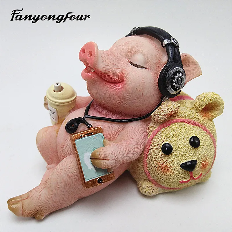 

Fan Yong four creative music pig silicone mold DIY can be used to make resin plaster concrete decorative crafts and ornaments