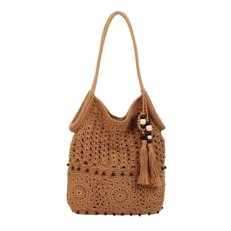 

New comfortable handmade woven bag rustic wind niche simple pure color hollow beaded tassel hundred shoulder armpit bags