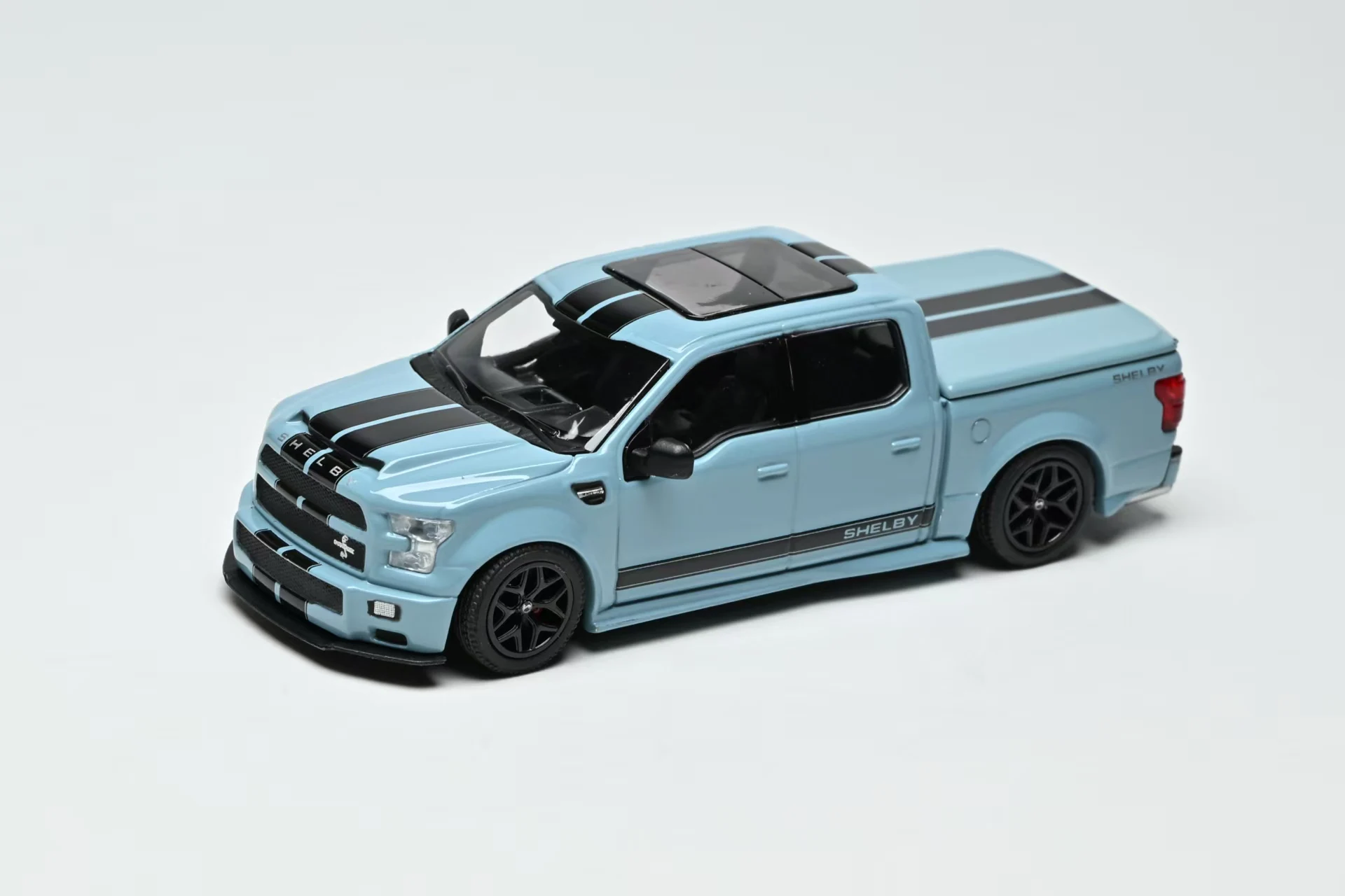 

Забавная модель 1:64 Ford F150 Super Snake Area 51 с синими/черными гоночными полосами, литая под давлением, из сплава, коллекционная.