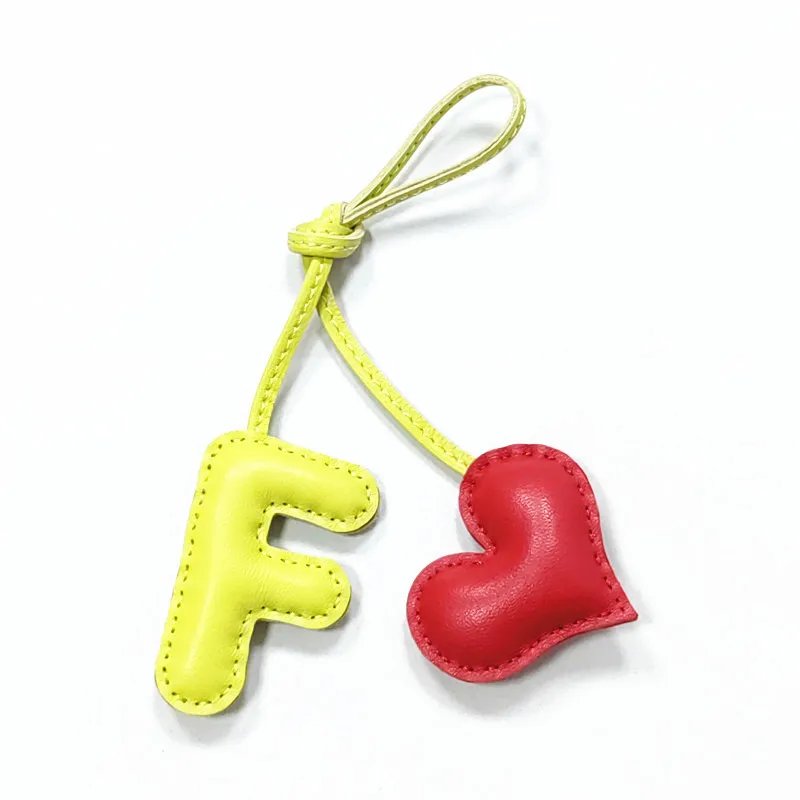 

Genuine leather F with heart-shaped letter style bag decoration with pure handmade stitching, high-end car keychain accessories