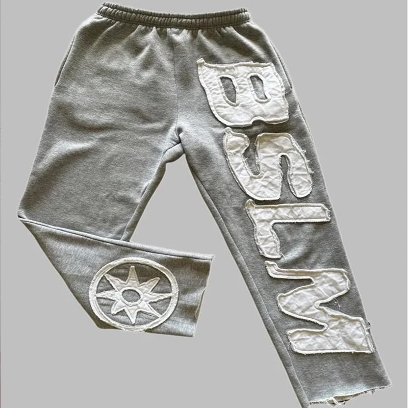 Outono inverno nova moda americana rua calças masculinas casal cintura elástica roupas esportivas carta remendo solto casual calças femininas