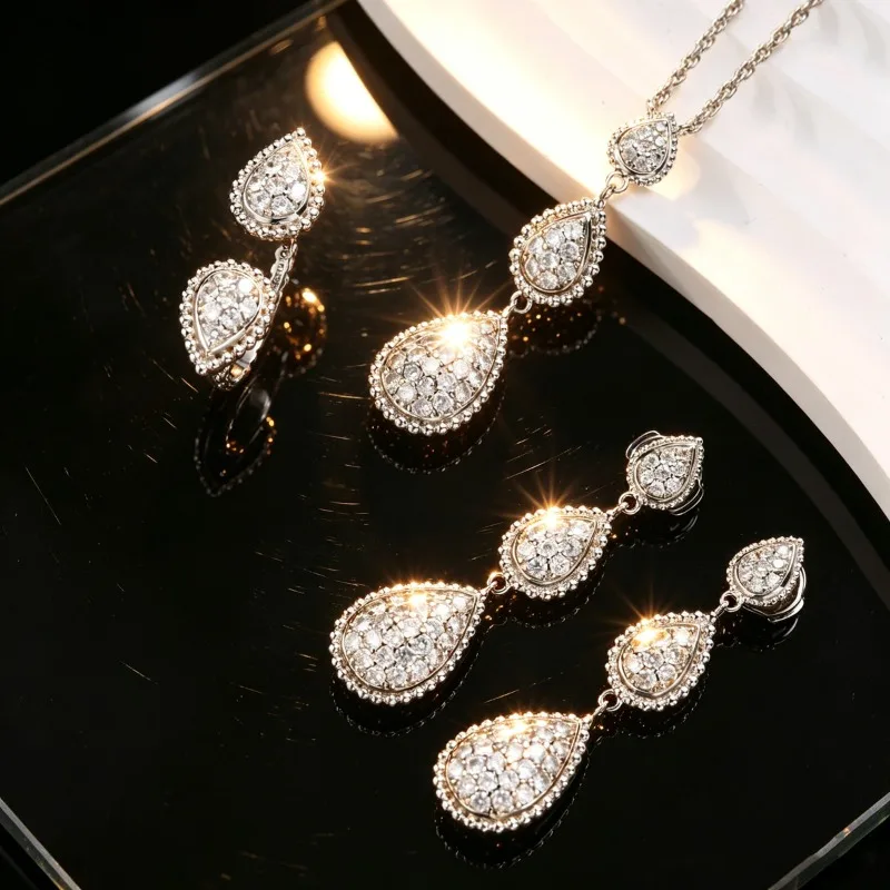 Light luxury copper inlaid zircon water drop necklace, earrings, ring set, flash high-end banquet accessories, collarbone chain