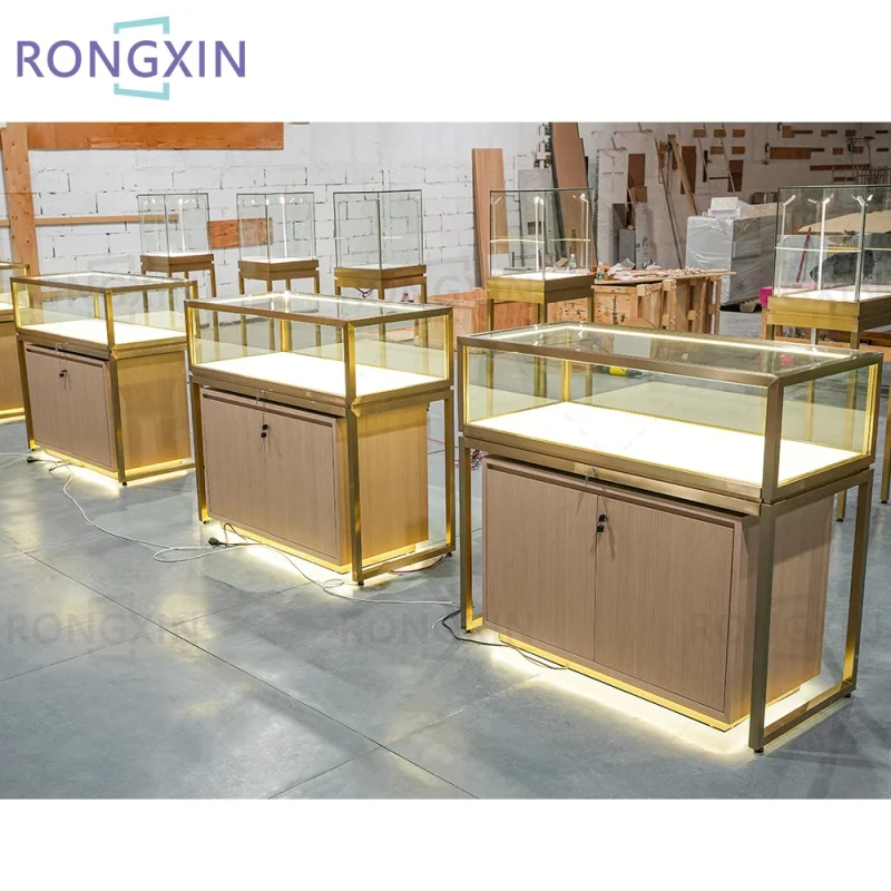 Customized product、Retail Store Jewelry Cabinet Luxury Gold Metal Jewelry Display Showcase LED Light Glass Display Table With Dr