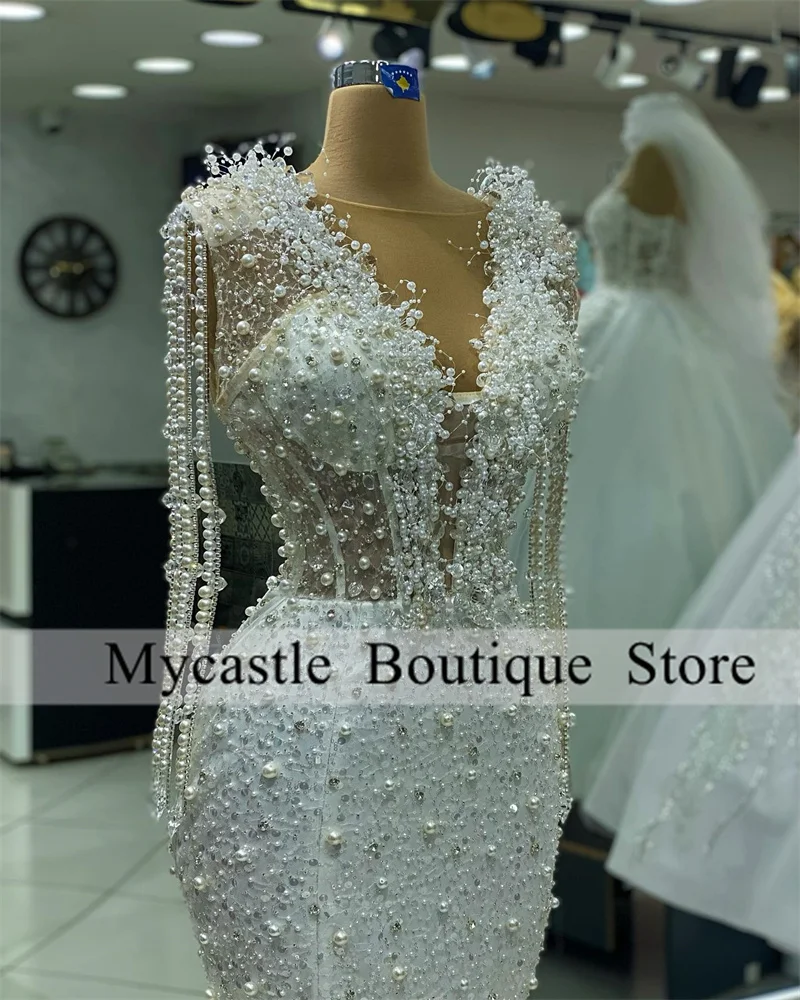 فساتين سهرة فاخرة بحورية البحر مطرزة باللؤلؤ الأبيض للنساء 2025 شرابات بطول الأرض للحفلات الراقصة فستان حفلات الزفاف حسب الطلب