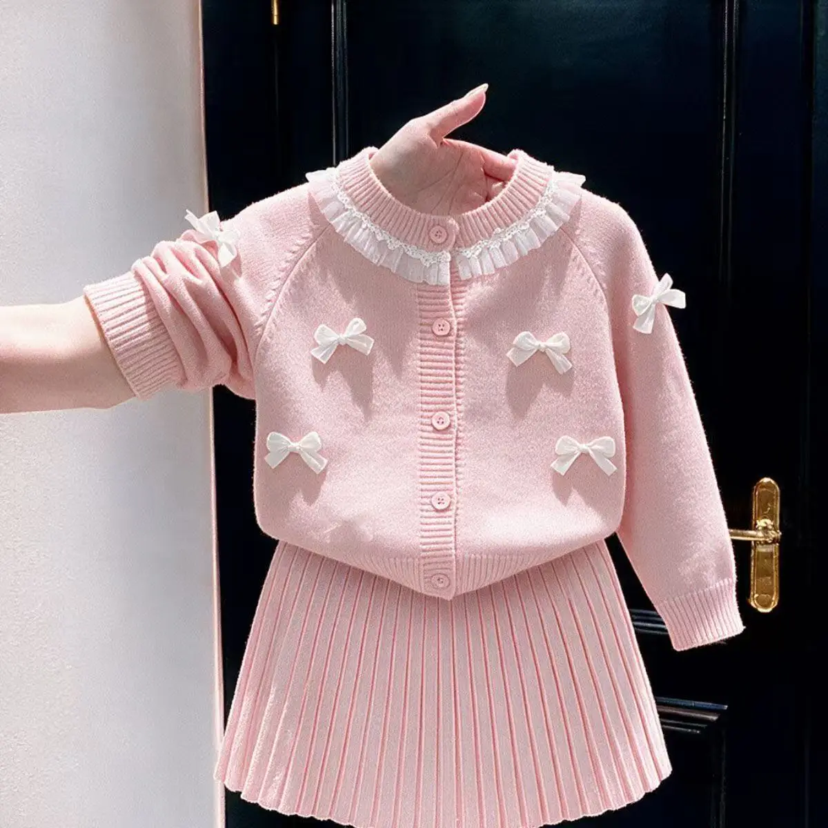 Girls' Knitted Set Autumn 2026 New Children's Pink Sweet Lace Bow Cardigan, Folding Skirt Two Piece Set 2-7Y