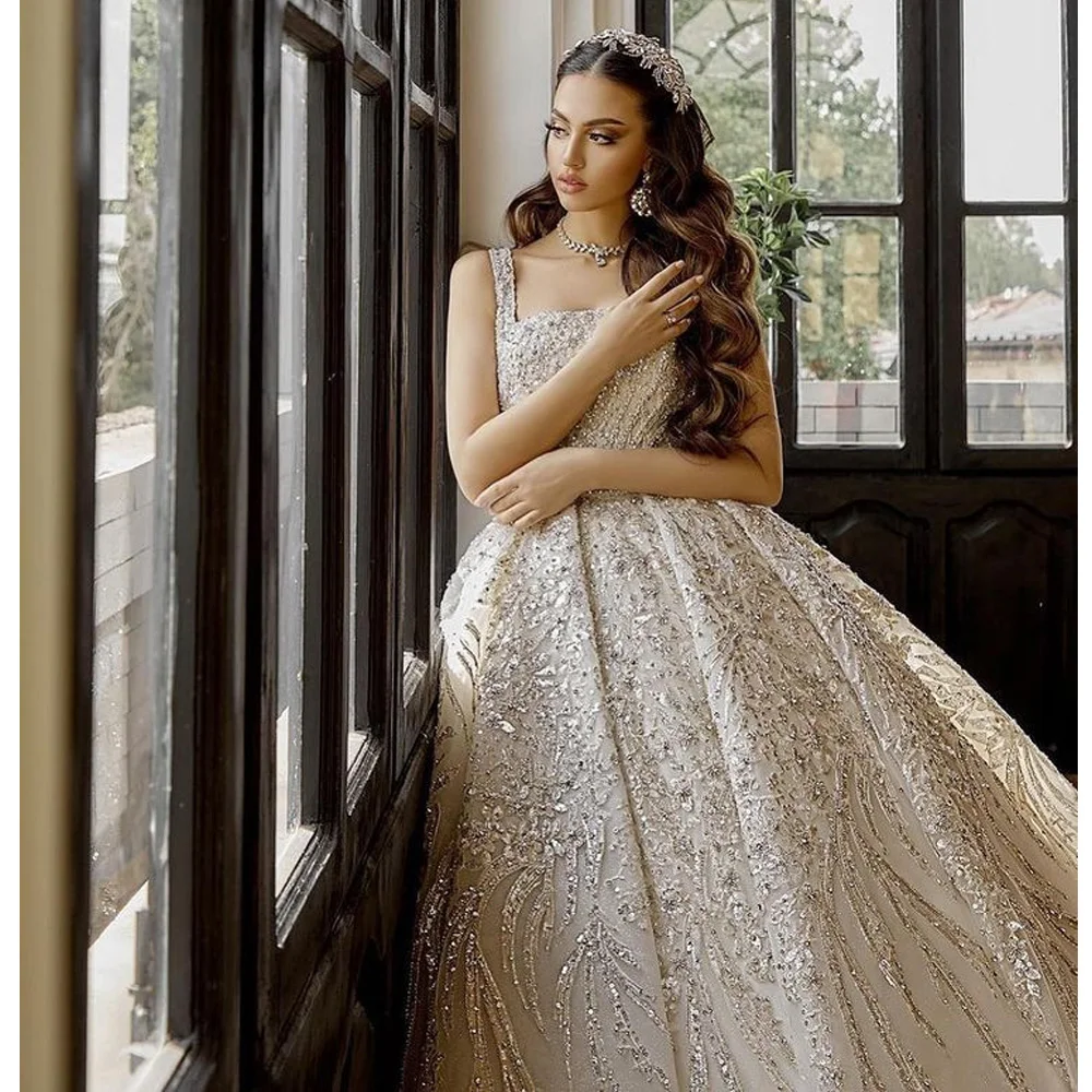 

2023 Romantic Dubai Square Collar Diamond Crystal Ball Gown Wedding Dress With Cape Feathers Saudi Arabic Sequined Bridal Gown