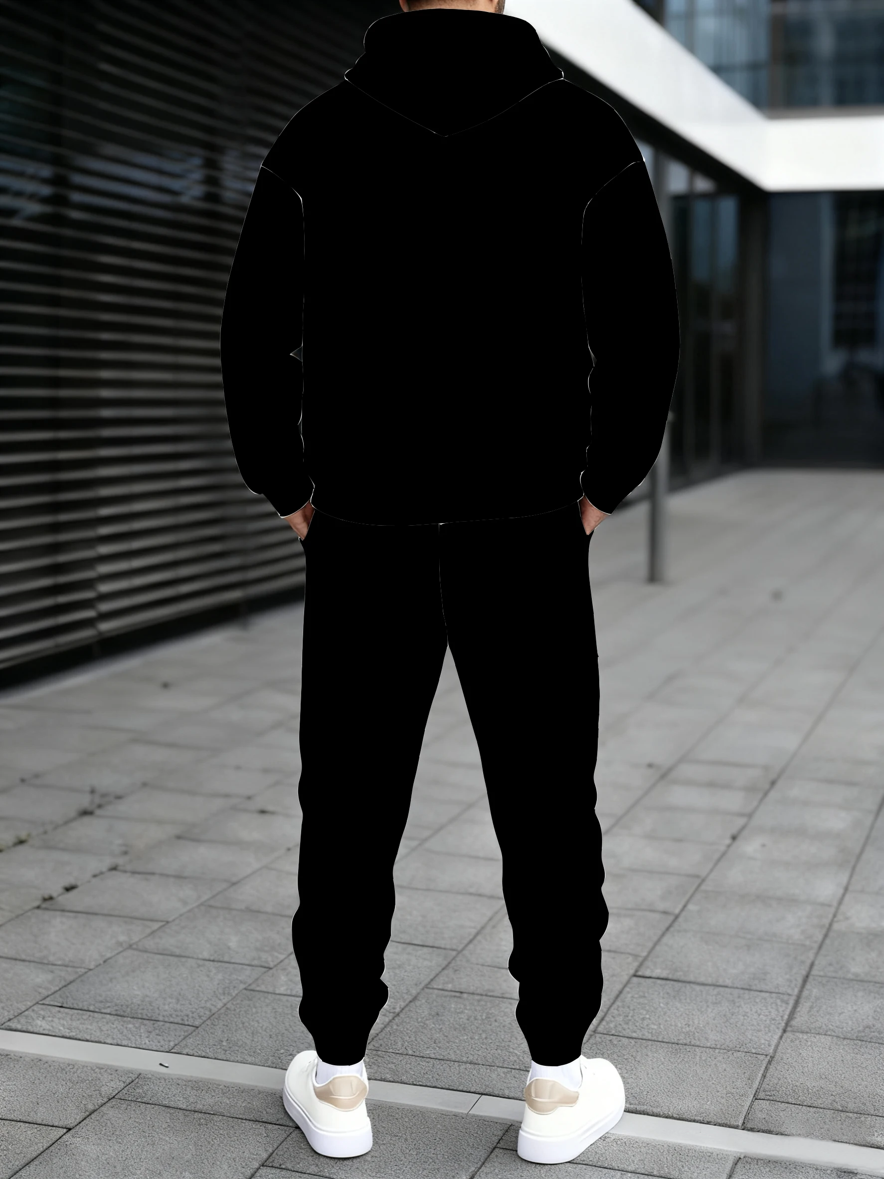 سويت شيرت رجالي بغطاء للرأس يقترن بنطال رياضي، مع خط هندسي بيضاوي متباين الألوان، ينبع نمط شارع متعدد الاستخدامات