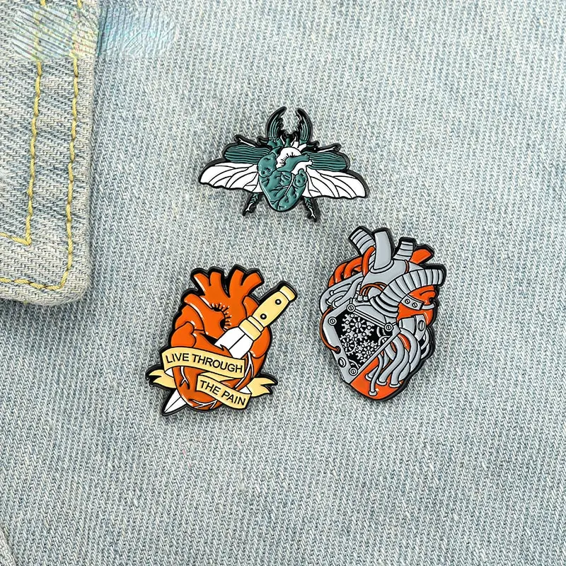 Live Through Pain Enamel Pins Custom Organ Heart Moth Assassinate Dagger Brooches Lapel Badge Punk Jewelry Gift Friend Wholesale