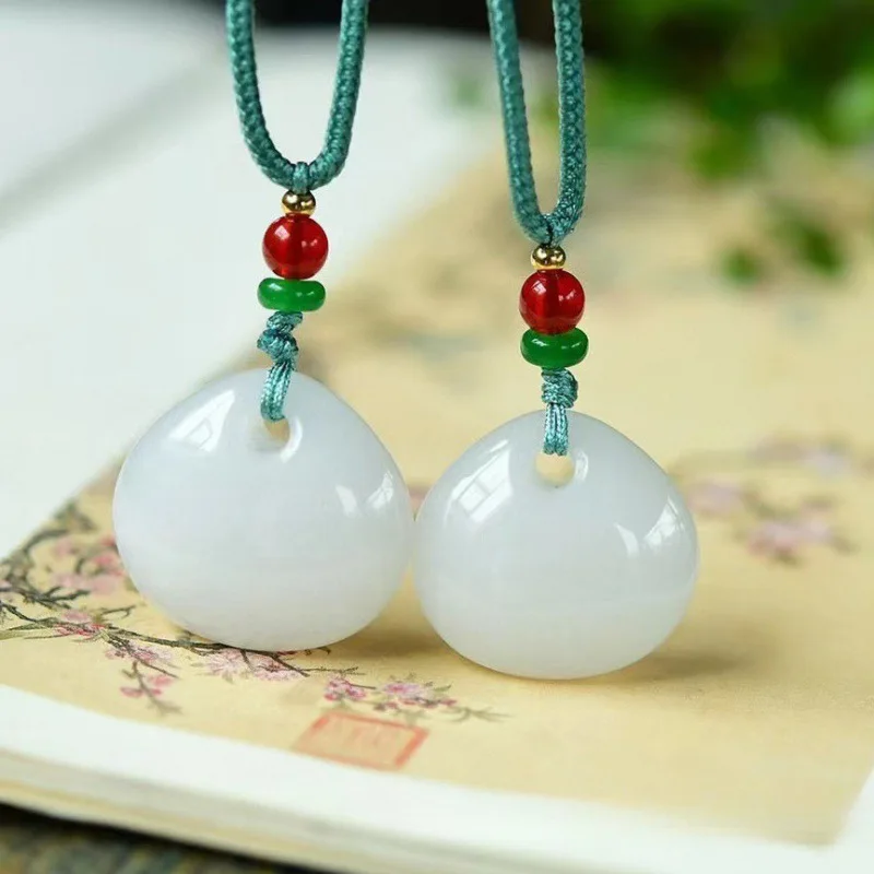 

Gold Silk Jade Pendant Xinjiang Imitation Hetian Jade White Jade Peace Buckle Lucky Bag Necklace Manufacturer Wholesale E-commer