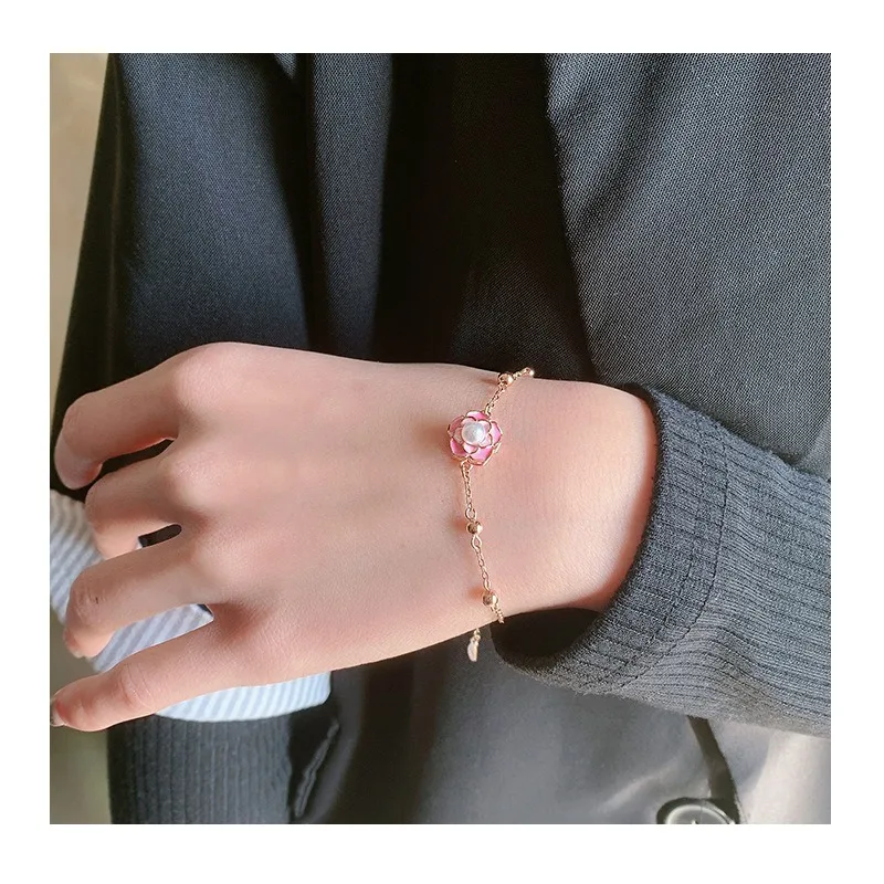 

There Is A Copyright Rotating Pearl Camellia Bracelet Flower Stacking All Over The Body