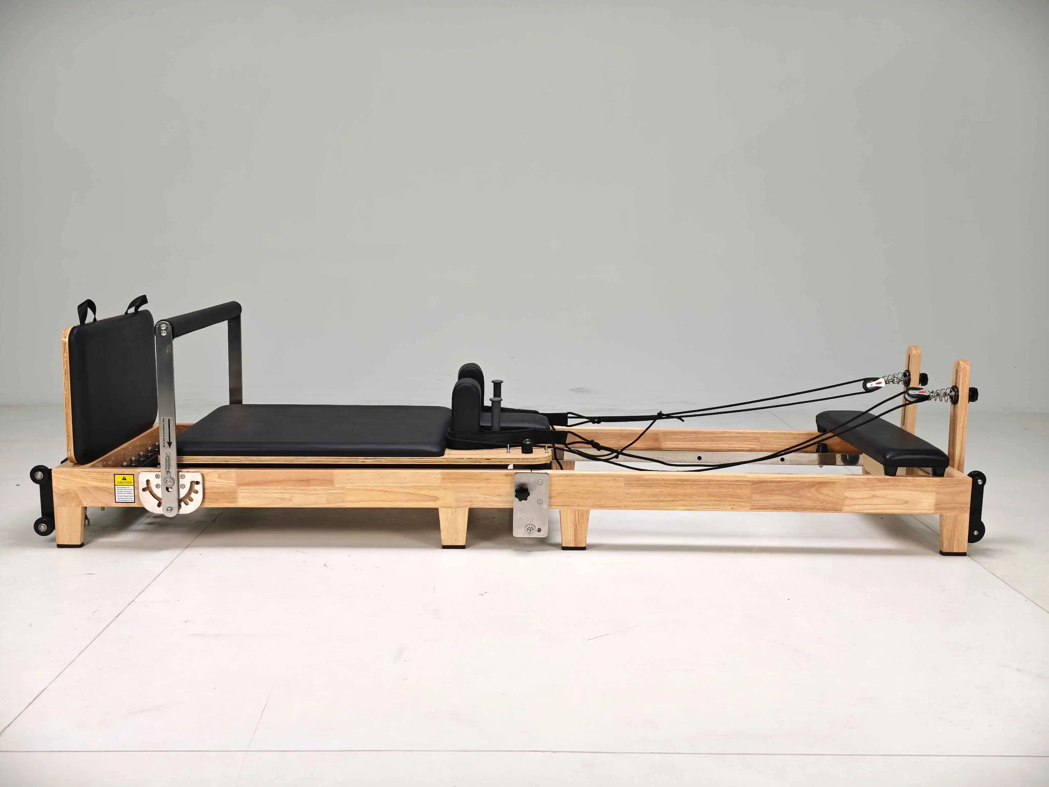 

Foldable Oak Pilates Reformer with Extendable Legs for Home Use