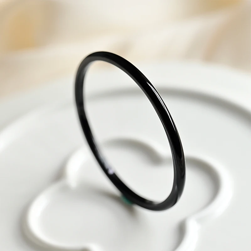 Black agate jingle bracelet with narrow strips and jade marrow bracelet