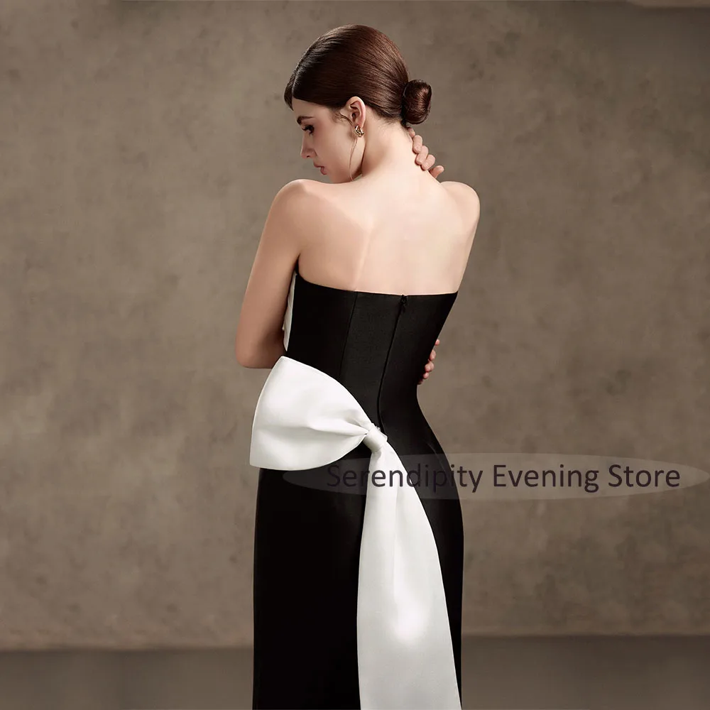 

Customized Women's Evening Dress Midi Strapless Pleated A Line Black Satin Evening Gowns 2026 Tea Length Ivory Bow Cocktail Gown