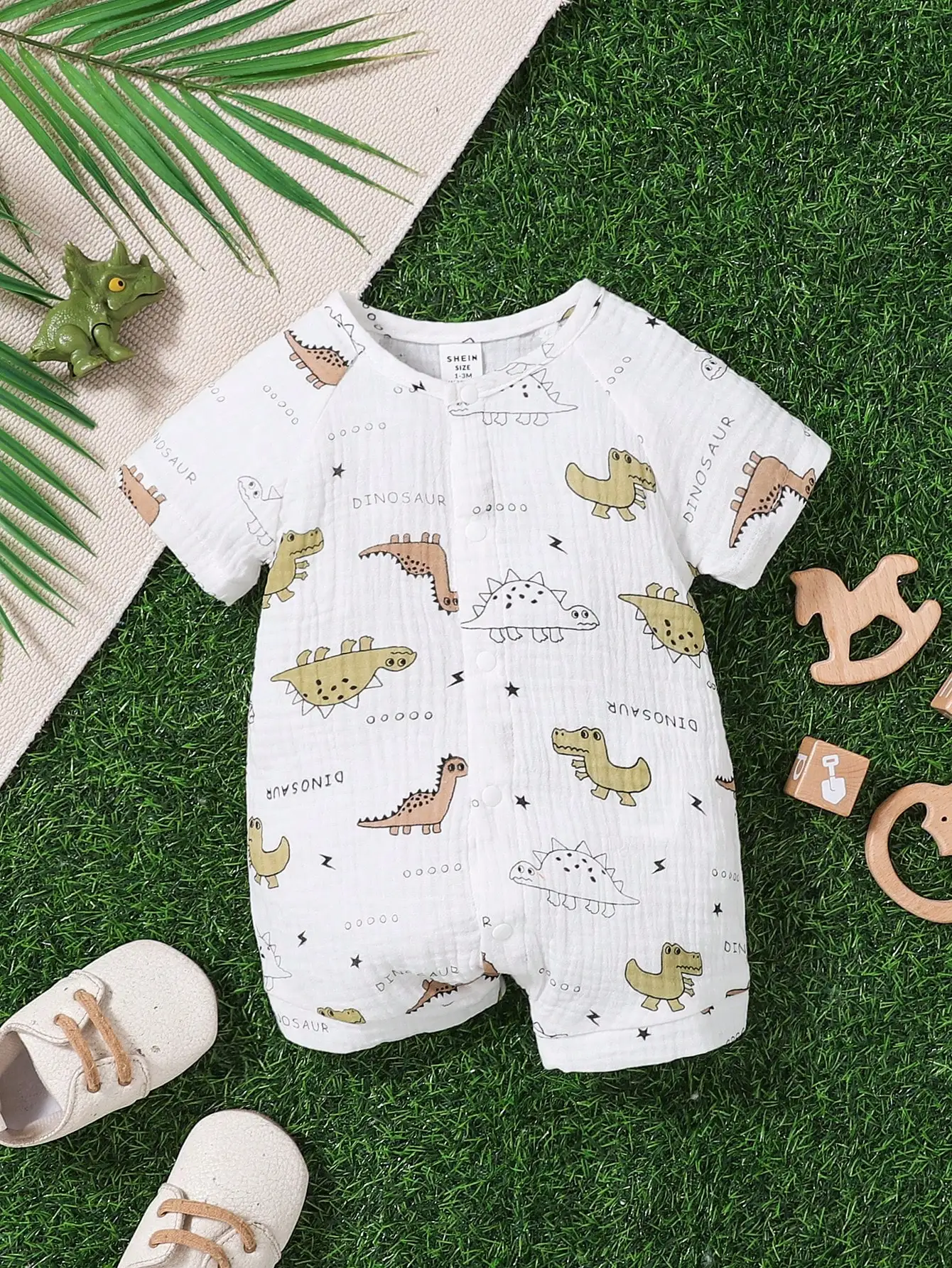 بدلة قفز صيفية جديدة للأطفال على شكل ديناصور كارتوني مطبوعة بالكامل بأكمام قصيرة مصنوعة من القطن الخالص، ناعمة ومريحة ولطيفة #1