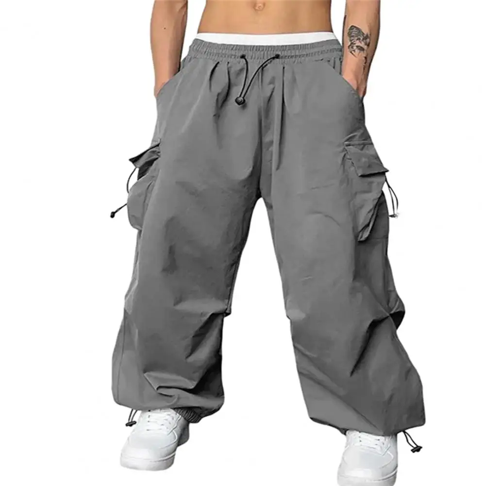 

Plus Size Men Cargo Pants Drawstring Elastic Waist Sweatpants Loose Deep Crotch Multi Pockets Breathable Men Long Trousers