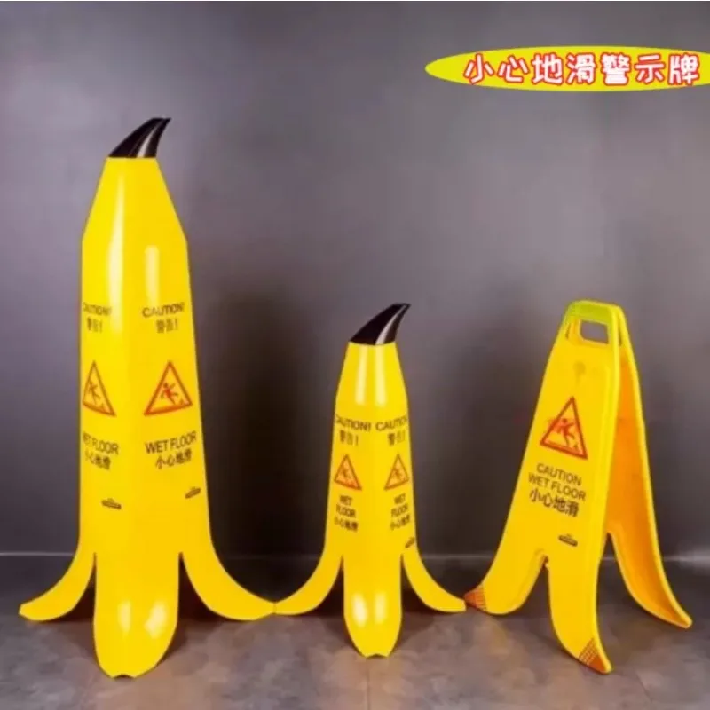 Banana peel shaped road cone carefully slides steps safety warning sign bank lobby hotel supplies creative sign