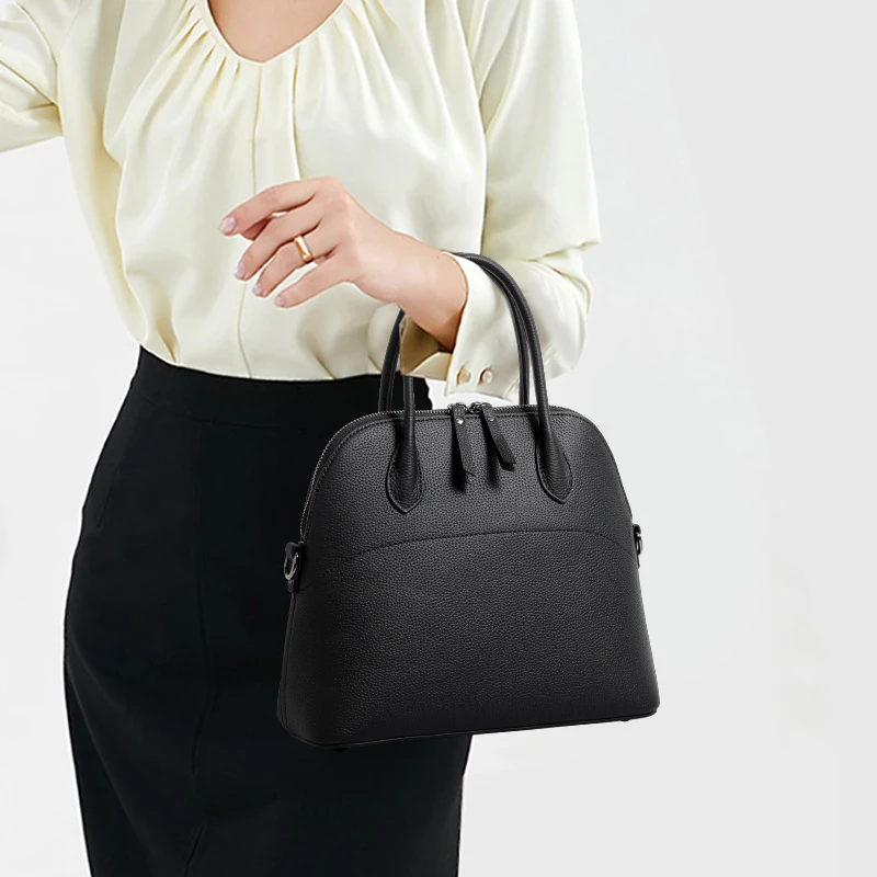 

Black Leather Dome Satchel: Classic Shape & Convertible Strap