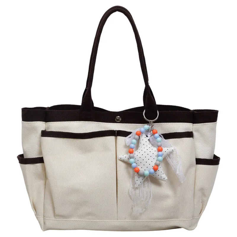 New color-blocked, multi-pocket canvas tote bag for women, large capacity, suitable for commuting and as a shoulder bag2026New v
