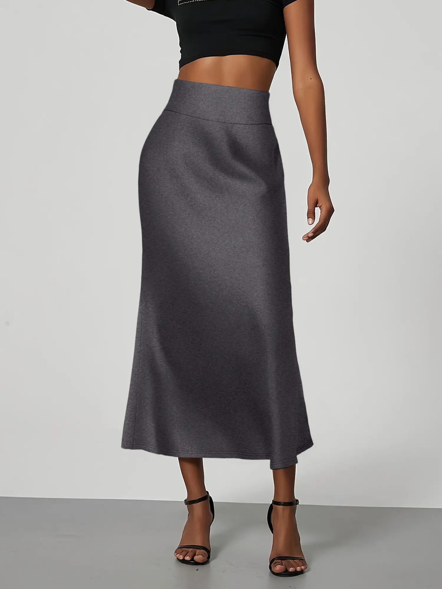 تنورة متوسطة الطول بحورية البحر بلون موحد، مصنوعة من نسيج ناعم ومقاوم للتجاعيد. أسلوب متوسط الطول يسطح الشكل، مما يجعلها