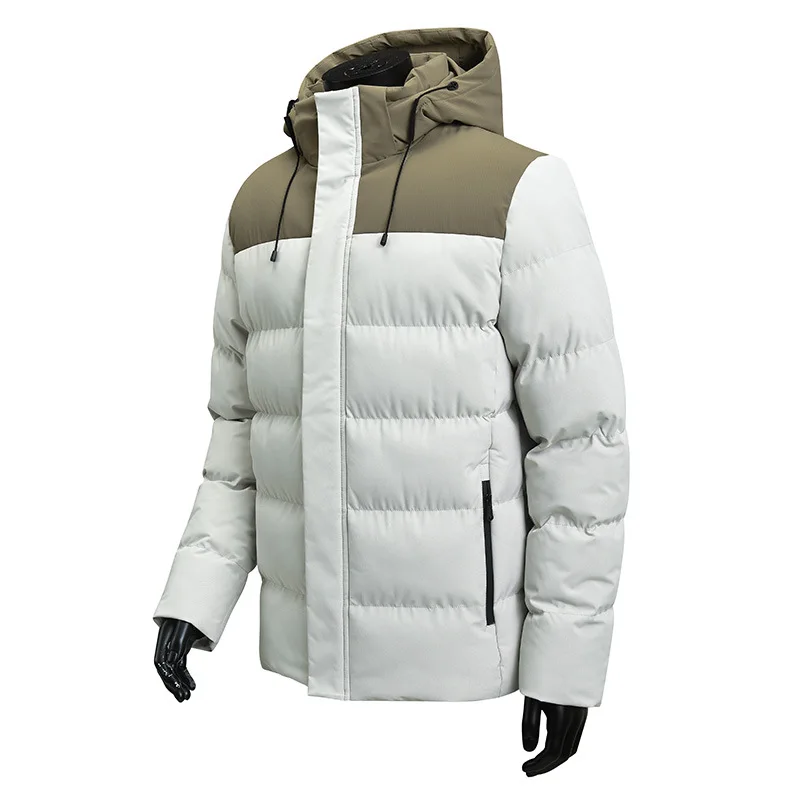 La nueva chaqueta acolchada de algodón con capucha y bloques de color de invierno para hombre es informal y versátil, gruesa, cálida y elegante.