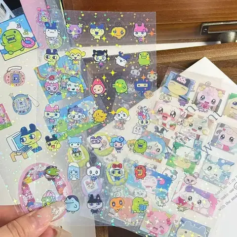Tamagotchi pegatina doble transparente dibujos animados pixel Mametchi película de corte láser pegatina manual taza funda de teléfono móvil pegatina