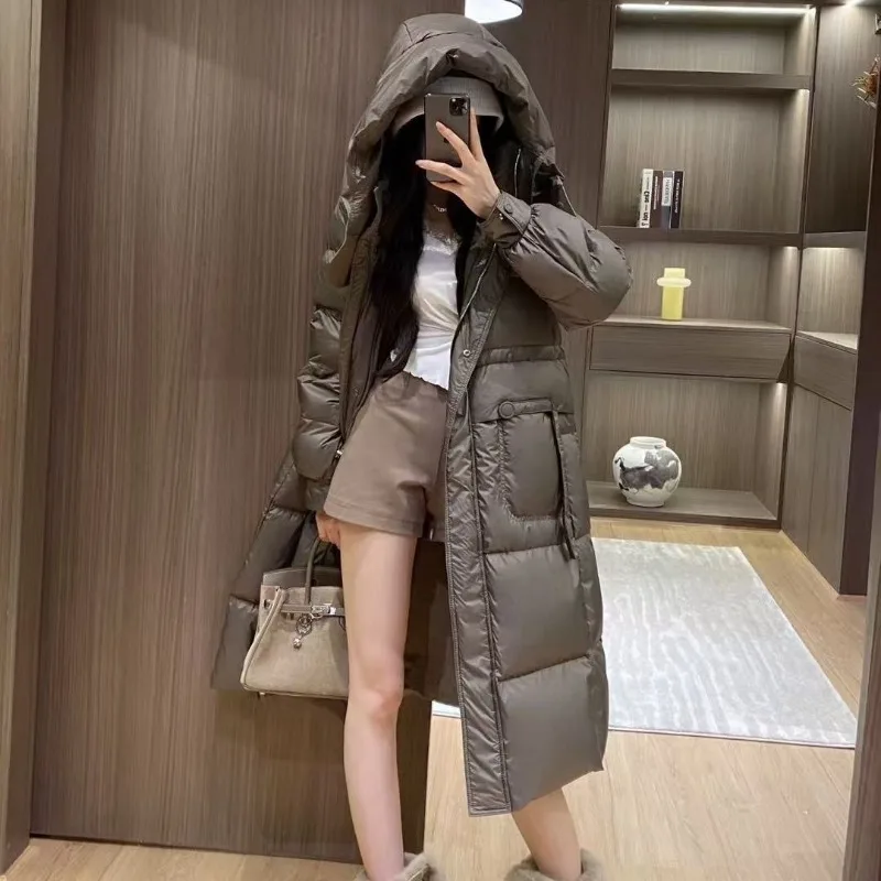 Pendolarismo alla moda ed elegante nell'autunno inverno Piumini da donna Soffio di fascia alta Piumino leggero di lusso con cappuccio in vita Muse