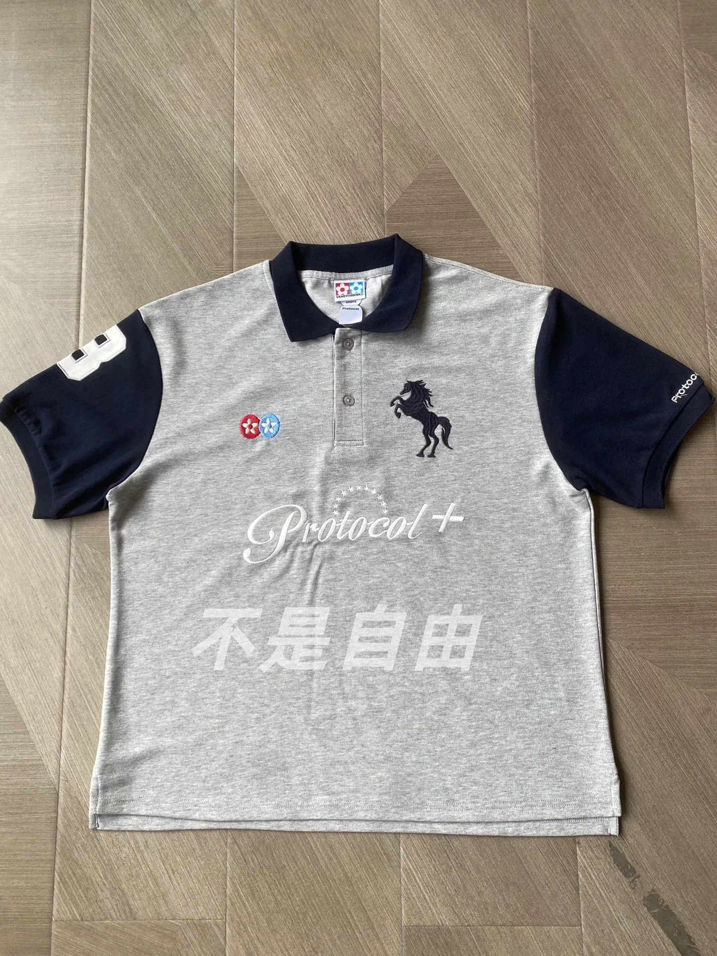 Grailz PROJECT G/R Limited Edition Letter Print Combat Spurs Embroidered Badge Patchwork Polo Neck Short Sleeve Protocol Index