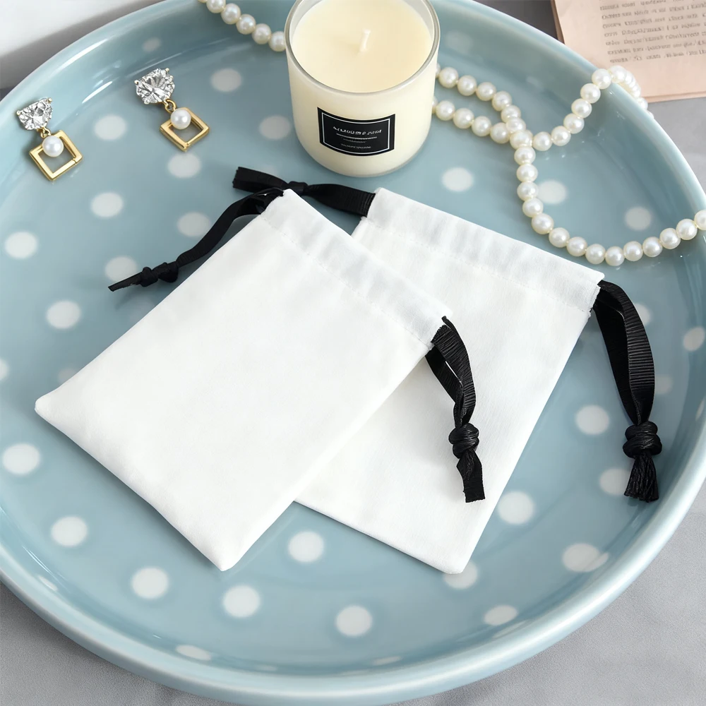 

50/100 шт., белая парусиновая хлопковая веревка, подарочная сумка на шнурке, упаковка для ювелирных изделий, сумка для хранения обручальных колец, серьги-гвоздики, упаковка