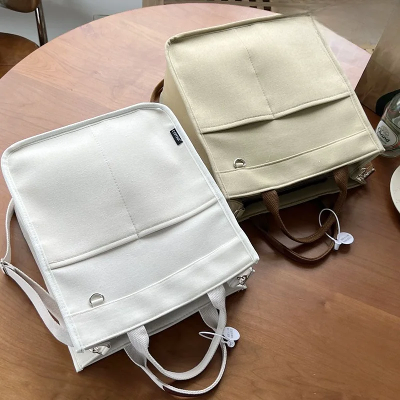 Artistic Zipper Canvas Tote for Commuters: Casual Single Shoulder, Handheld, and Crossbody Bag for Students