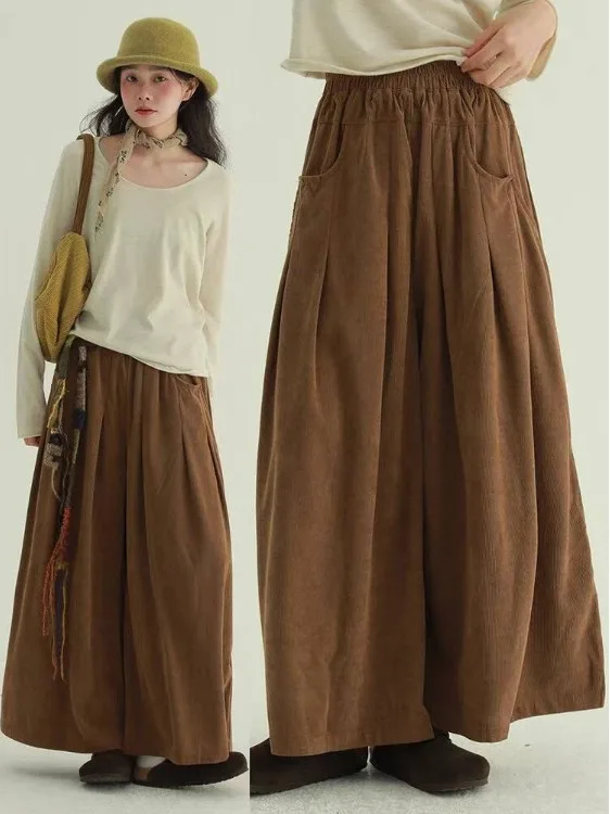 

Ретро-брюки с плиссированным дизайном из цветного вельвета, широкие штанины, свободный крой, повседневные брюки-юбка для женщин больших размеров, длинные брюки с эластичным поясом.